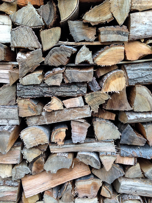 Photo of firewood split and stacked for the winter