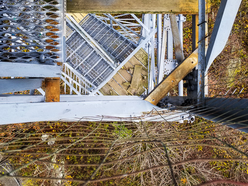 Photo looking straight down through a removed staircase landing at the Mount Nimham fire tower
